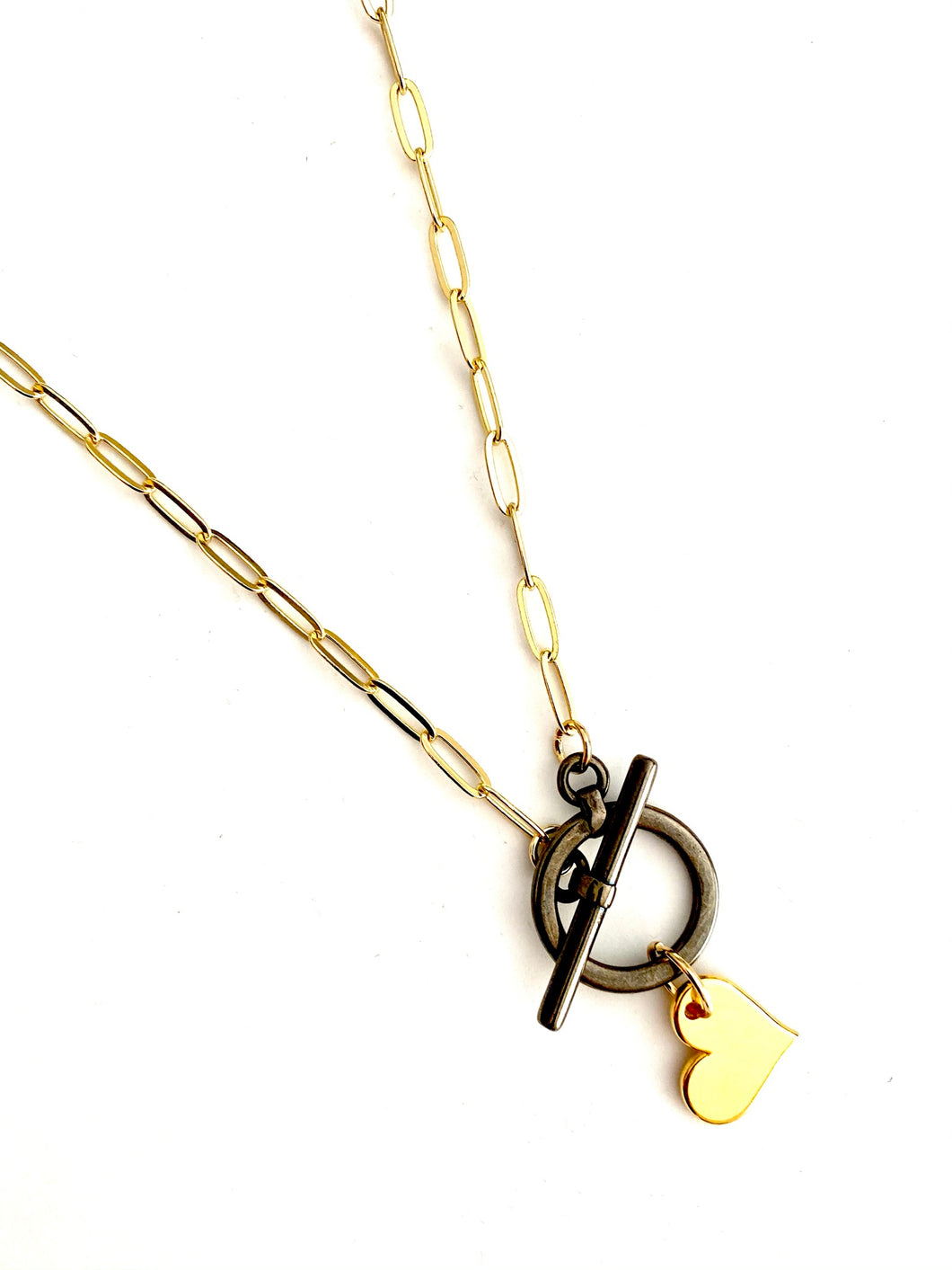 Gold chain with black metalic clasp and heart necklace