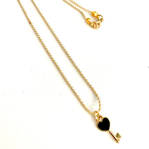 Short necklace with tiny charm